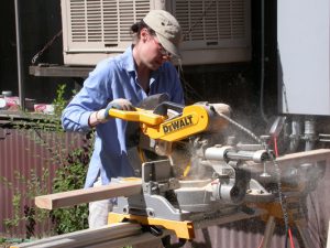 Architect running power tools